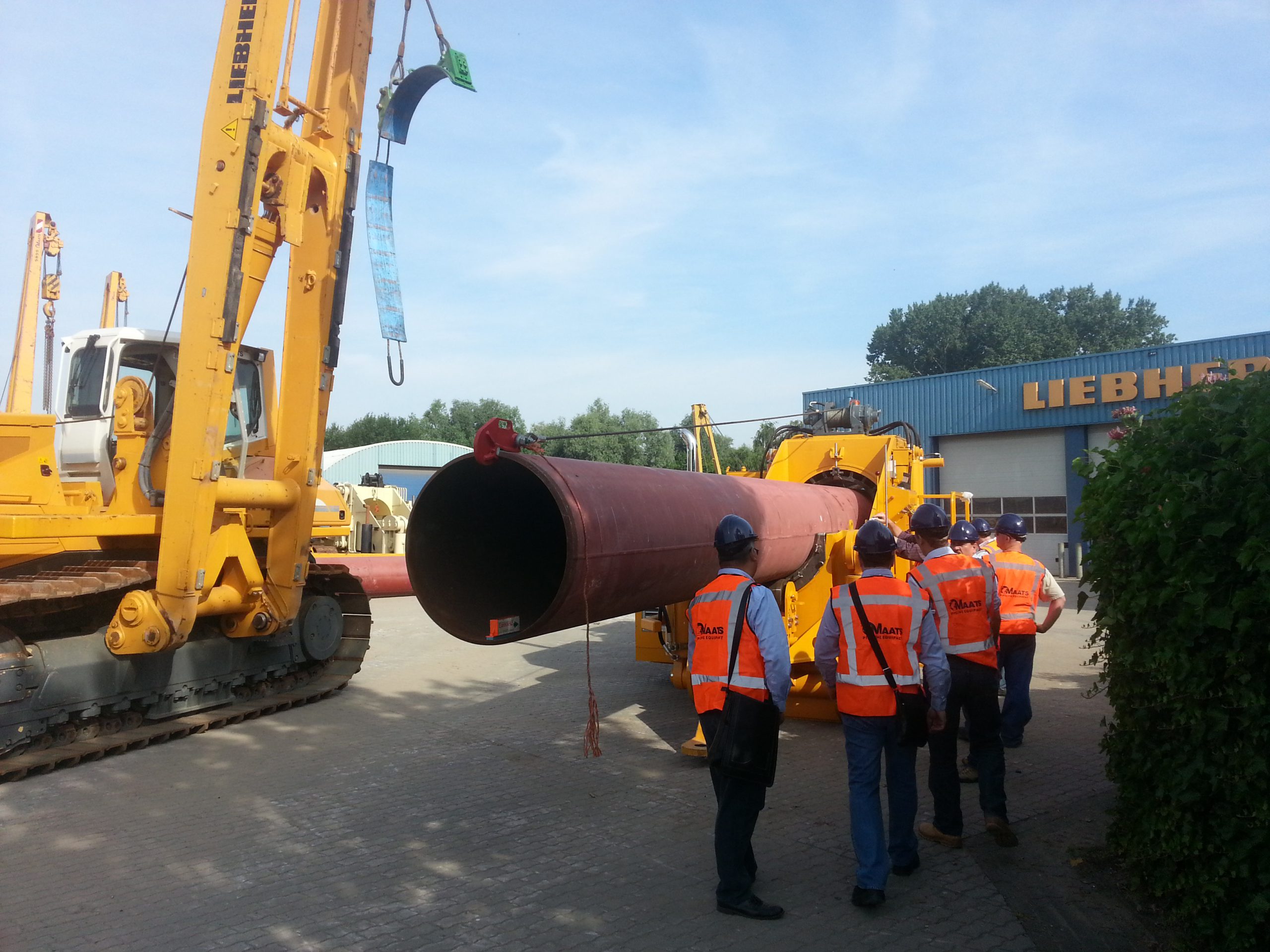 MAATS team overseeing pipeline bending operation with Liebherr equipment