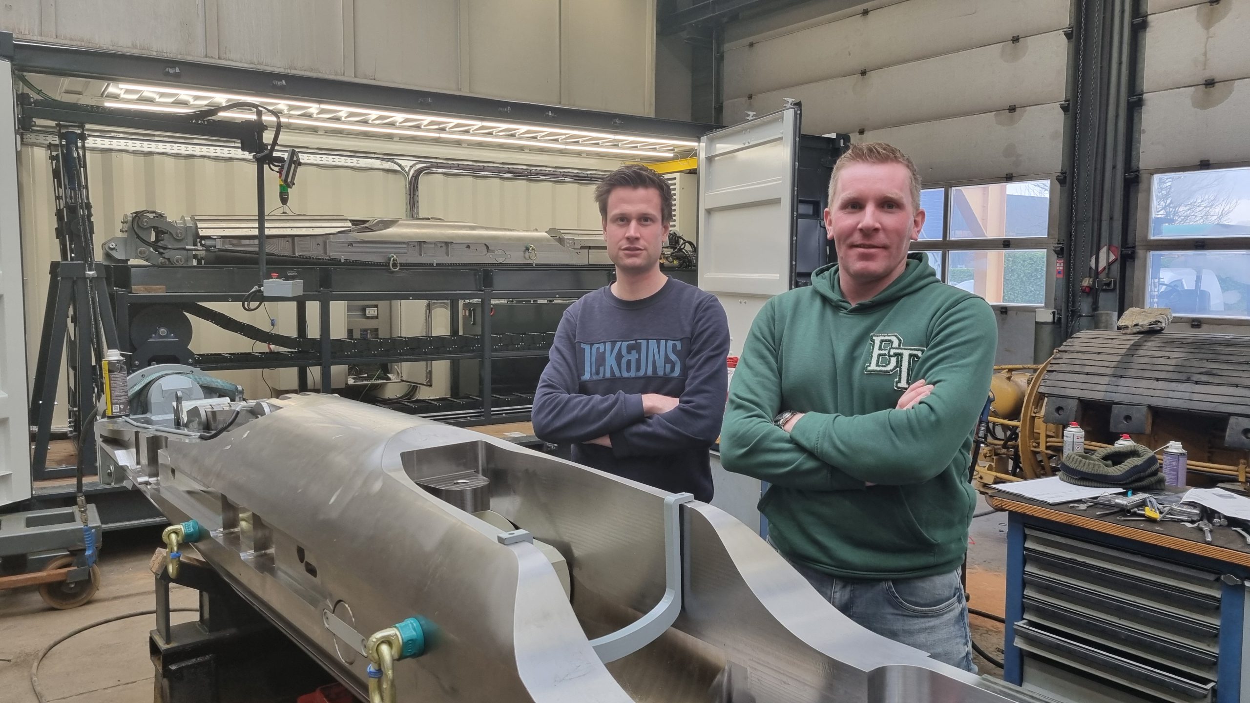 Tom and Gieljan standing in the MAATS garage
