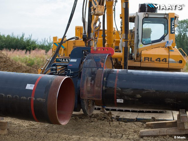 Pipeline welding alignment supported by MAATS Liebherr RL44 pipelayer.